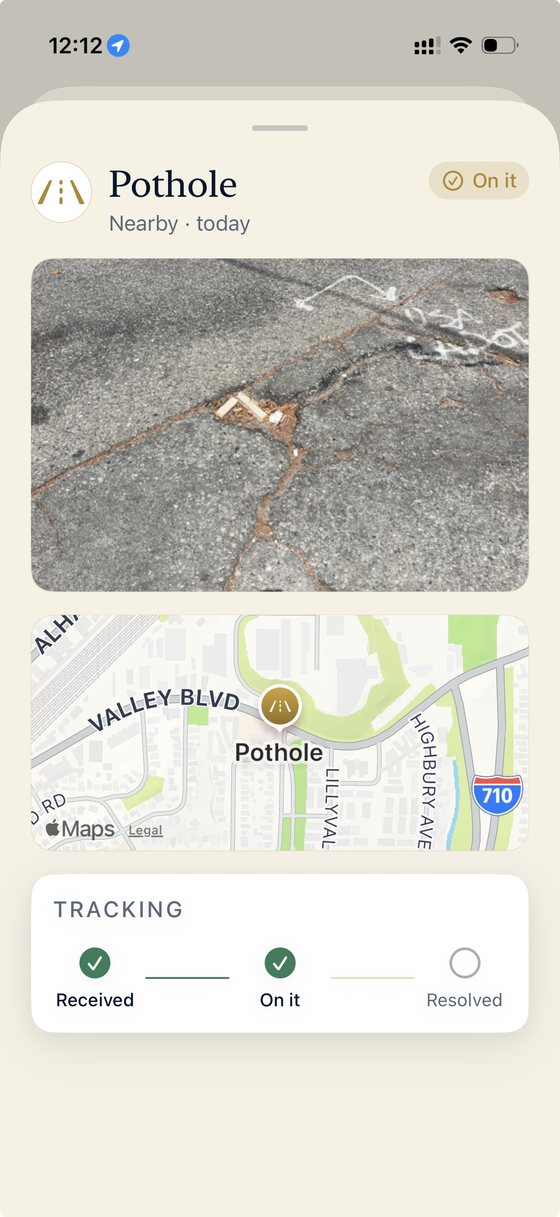 A pothole report card with photo, map and a tracker at On it
